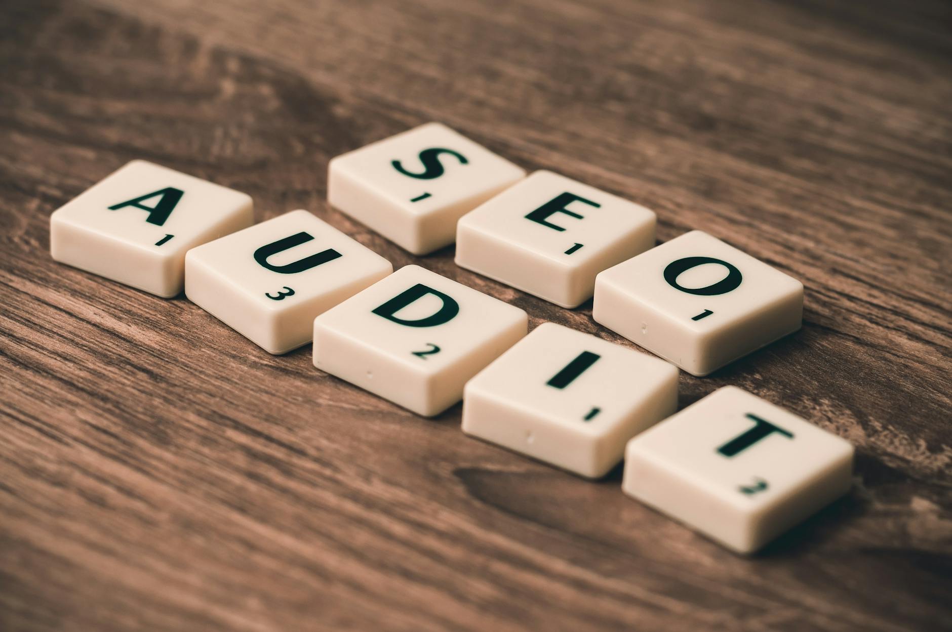 Scrabble tiles spelling SEO Audit on wooden surface